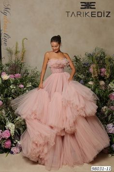 Looking for an elegant and eye-catching dress for your next special event? Check out the Tarik Ediz 98031 from the Spring 2022 evening collection. This gorgeous tulle dress comes in a variety of colors to suit any style, and it's sure to make you stand out from the crowd. Whether you're attending a wedding, formal dinner, or another special occasion, this is the perfect dress to ensure that you look and feel your best. Order yours today and be ready for any event on your calendar! Ruffled Formal Dress, Tool Dress Tulle, Ruffled Tulle Dress, Big Tulle Dress, Flower Ruffle Dress, Big Dress Poses, Puffy Dresses Ball Gowns, Formalite Dress, Jenna Core