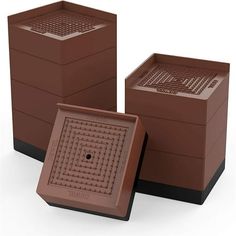 three brown boxes sitting next to each other