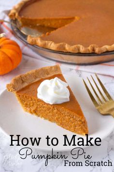 a slice of pumpkin pie on a white plate with a gold fork next to it