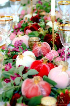 the table is decorated with flowers and candles