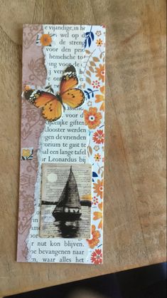 a piece of paper that has been altered to look like a bookmark with butterflies on it