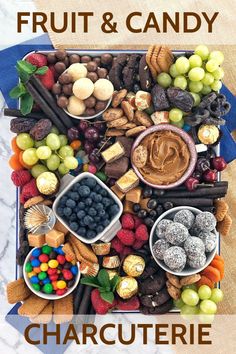 a tray filled with fruit and candy on top of a table