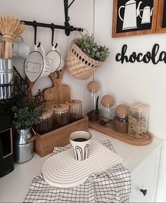 a kitchen counter topped with lots of food and cooking utensils on top of wooden trays