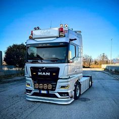 a large semi truck parked in a parking lot