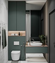 a modern bathroom with green walls and white flooring, including a toilet and sink