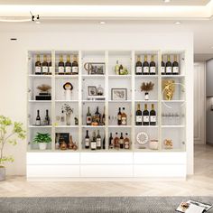 a living room filled with lots of bottles and vases on top of white shelves