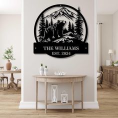 a wall mounted sign that says the williamss est 2094 with mountains in the background