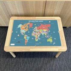 a wooden table with a world map on it