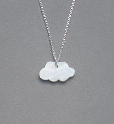 In the Clouds Necklace This cute necklace is perfect for that special someone whose head is in the clouds or needs their head to be in the clouds.  That person who is so driven or serious and needs a reminder to take a minute to look at the clouds.   The pendant is acrylic in the shape of a cloud. The pendant measures 1/2" x 3/4"" and hangs on a 1.3 mm silver plated curb chain. You can add the initial or other charms with separate listings in my shop. You can the length from the drop-down list. Clouds Necklace, Cloud Necklace, Drop Down List, In The Clouds, Cute Necklace, Curb Chain, The Clouds, Chain Pendants, Pendant Necklaces