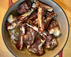 meat is cooking in a pan on the table