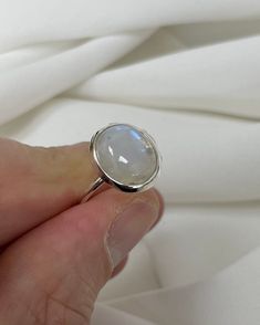 "Fine and Dainty sterling silver ring decorated with a moon stone Material: Silver Stone: MoonStone Available Sizes: J - P All of our jewellery is professionally inspected, All items sold are Genuine Please do not hesitate to contact me if you require any further information or have any problems Any issues I will ensure that they are resolved with 100% customer satisfaction Note: Customized Jewellery is available if you need any jewellery design in any size contacts us right-now to get your desi Silver Moonstone Ring Fine Jewelry For Gift, Sterling Silver Oval Cabochon Moonstone Ring, Oval Cabochon Moonstone Ring In Sterling Silver, Silver Sterling Silver Moon-shaped Opal Ring, Silver Sterling Silver Moon Shaped Opal Ring, Silver Moon-shaped Sterling Silver Opal Ring, Minimalist Sterling Silver Cabochon Moonstone Ring, Silver Sterling Silver Moonstone Ring As Gift, Moon-shaped Sterling Silver Moonstone Ring As Gift