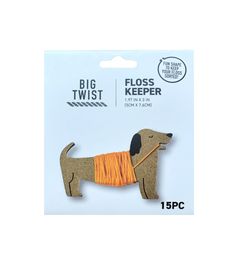 a brown dog with an orange ribbon on it's collar is in the packaging