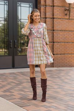 A "Pink and Yellow Plaid Dress" is an adorable fashion choice that radiates charm and playfulness. This delightful dress showcases a playful pattern featuring intersecting horizontal and vertical lines, creating a delightful grid of squares or rectangles. The dominant colors in this dress are the sweet and cheerful hues of pink and yellow, which combine to create an irresistibly cute and lively look.Material: 100%cottonFit: True To Size Our model is wearing a size small Preppy Mini Length Dress For Spring, Trendy Plaid Mini Dress For Spring, Cute Pink Mini Dress For Fall, Trendy Mini Length Spring Plaid Dress, Preppy Mini Length Spring Dress, Spring Plaid Dress For A Day Out, Plaid Dress For Day Out In Spring, Plaid Dress For Spring Day Out, Spring Plaid Midi Dress