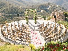 an outdoor ceremony set up in the mountains