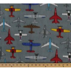 a gray background with small airplanes on it