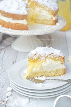 a piece of cake on a plate with a fork in front of it and another slice missing