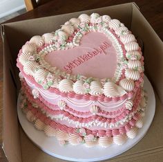 a heart shaped cake in a cardboard box