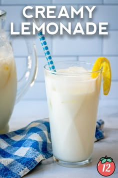 a pitcher and glass filled with creamy lemonade on top of a blue checkered towel