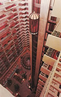 an aerial view of a tall building with lots of windows