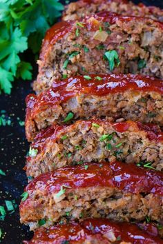 sliced meatloaf with ketchup and parsley on the side