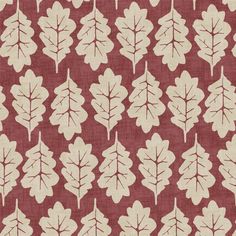 a red and white fabric with leaves on it