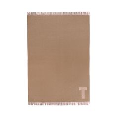 a tan towel with the letter t on it