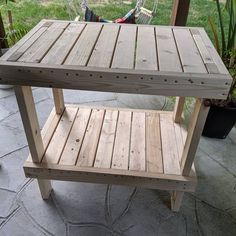 a wooden bench sitting on top of a patio