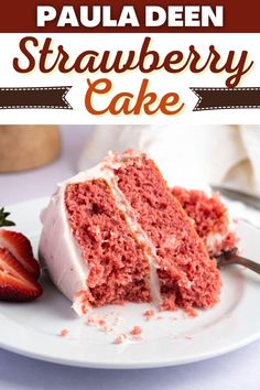 a close up of a slice of cake on a plate with strawberries in the background