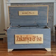 a wooden box sitting on top of a hard wood floor