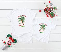 Tropical Christmas shirts,Christmas on the beach,Christmas palm tree,Family Christmas shirts,Christm Christmas Florida, Christmas On The Beach, Christmas Matching Shirts, Christmas Palm Tree, Family Holiday Gifts, Family Pjs, Tree Family, Tropical Christmas, Xmas Tees