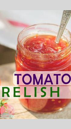 a jar filled with tomato relish sitting on top of a cutting board