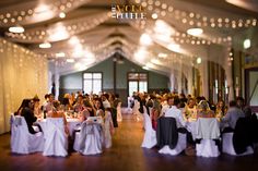 a banquet hall filled with people sitting at tables