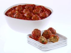 meatballs and sauce in a white bowl on plates