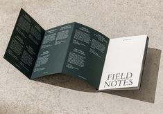 an open field notes book laying on the ground