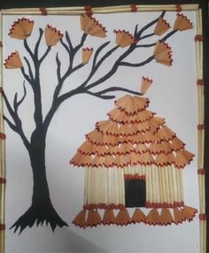 an art project made out of paper with a tree and birdhouse in the background