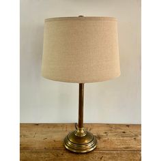 a lamp that is on top of a wooden table