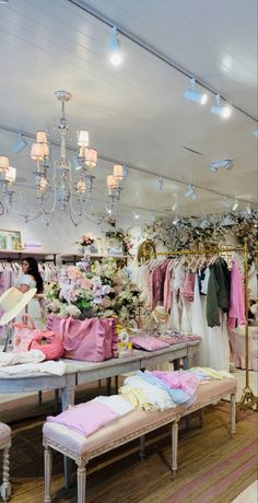 a clothing store filled with lots of pink and white items