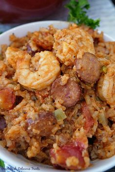 a white bowl filled with shrimp and rice