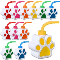 several different colored dog paw shaped toothbrushes