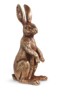 a bronze statue of a rabbit sitting on its hind legs