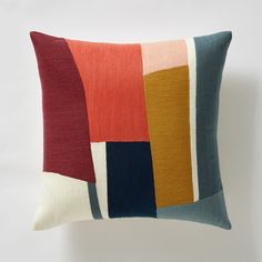 a multicolored pillow on a white background with the same color as it appears