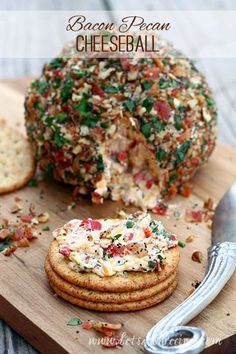 a cheese ball and crackers on a cutting board