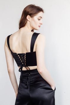 Satin lace-up corset top ANDREA with a square neckline. You can choose corset with lace up or buttons. Just mention this in personalization option. You can wear it with: Oversize jacket: https://www.etsy.com/listing/962180710/jacket-andrea-bridal-suit-city-hall?ga_search_query=jacket&ref=shop_items_search_3&pro=1&frs=1 Palazzo pants: https://www.etsy.com/listing/976154459/satin-pants-andrea-city-hall-wedding?ga_search_query=palazzo&ref=shop_items_search_2&pro=1&frs=1 Crep Satin Crop Top With Boned Bodice For Party, Party Satin Crop Top With Boned Bodice, Chic Sleeveless Corset With Lace-up Back, Sleeveless Boned Bodice Crop Top For Party, Party Satin Corset Dress With Lace-up Back, Sleeveless Party Crop Top With Boned Bodice, Fitted Cropped Corset With Corset Back, Party Cropped Corset With Boned Bodice, Cropped Party Corset With Boned Bodice