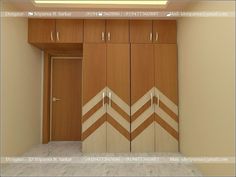 an empty room with wooden cupboards and doors