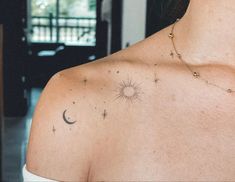 a woman's chest with stars and the moon on it