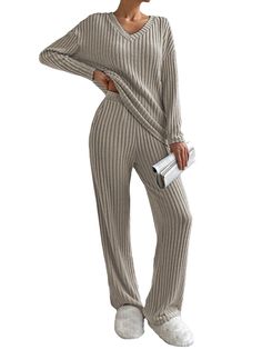 PRICES MAY VARY. 【Material】Ladies loungewear sets is made of a soft and warm fabric that has a textured vertical stripes ribbed pattern design,giving a slimmer silhouette,can be seen through slightly if stretched,not too thick or chunky,comfortable and cosy to wear 【2 Piece Lounge Set】Ladies leisure suits is designed with an oversized tops and wide-leg trousers,easy to put on and take off,Womens elegant ribbed knit jumpers has a relaxed and cozy feel,a v-neck design adds a sense of fashion,long sleeves keep arms warm on cold days,Elasticated waist lounge pants with useful pockets,loose fit 【Versatile and Lovely as a gift】V neck lounge wear sets can be worn together or separate,As a long jumper it looks great with jeans,trousers or leggings,It could be worn under a loose fitting cardigan or Lounging Outfit, Leisure Suit, Matching Pajamas, Activewear Sets, Ribbed Knit Sweater