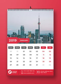 a red and white calendar with the city skyline in the background