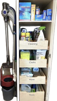 an open cabinet with cleaning supplies and other items