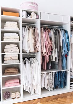 an organized closet filled with clothes and other items