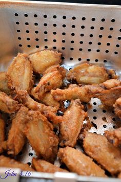 some fried food is in a metal bowl